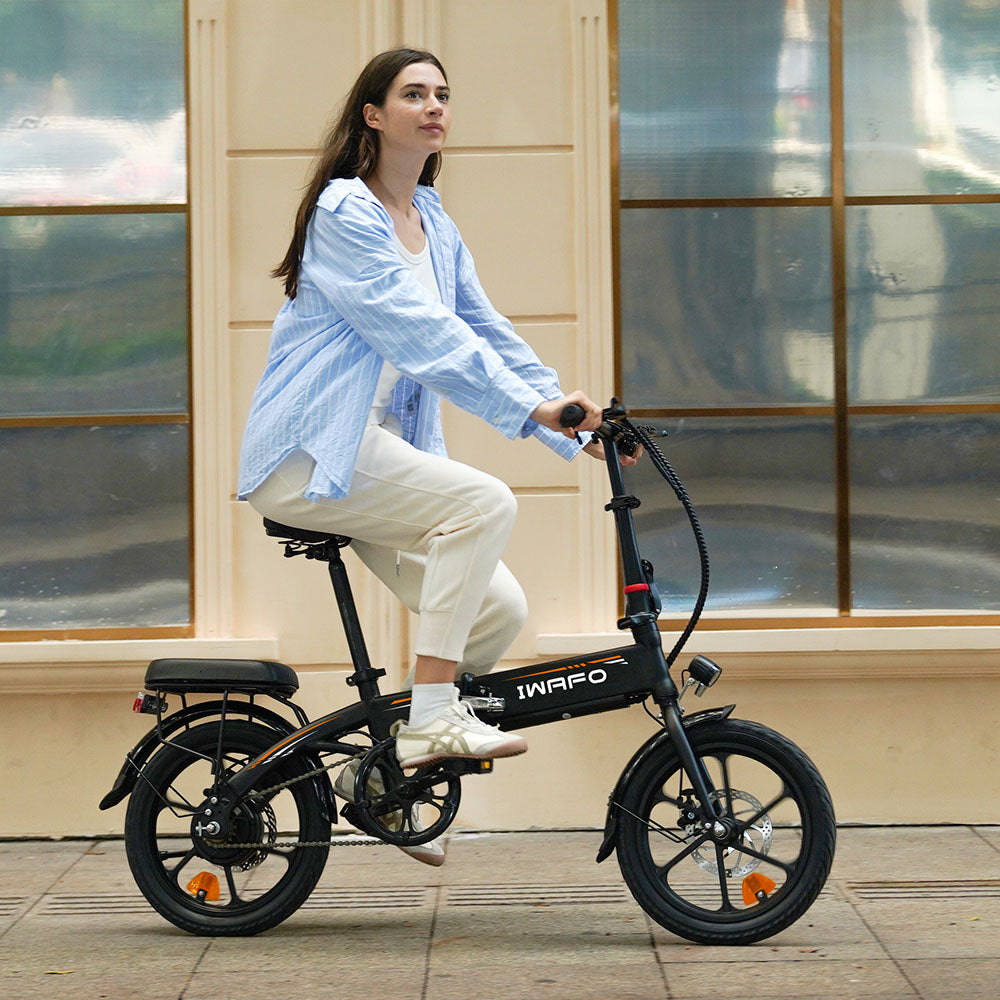 A_girl_is_riding_an_Electric-Bike-IWAFO-IE1_on_the_city_street