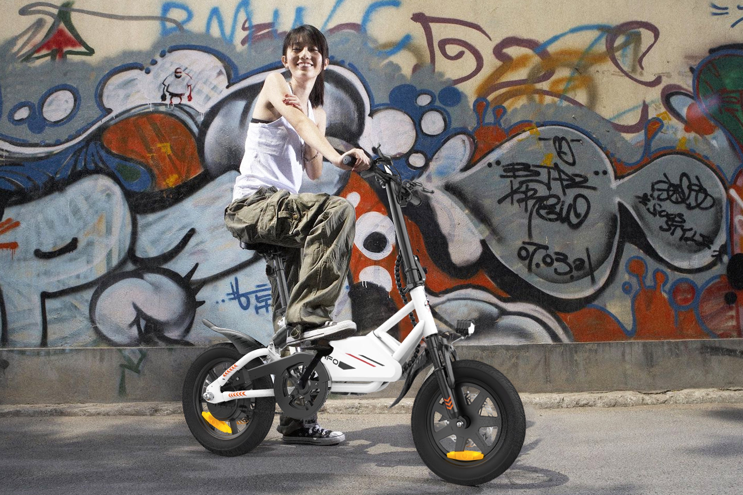 A_girl_is_taking_pictures_in_front_of_the_graffiti_wall_on_an_Electric-Bike-IWAFO-IE2
