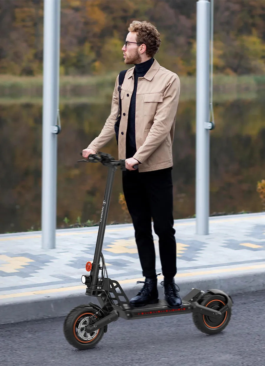 A_man_rides_an_Electric-Scooter-IWAFO-IS1_to_work
