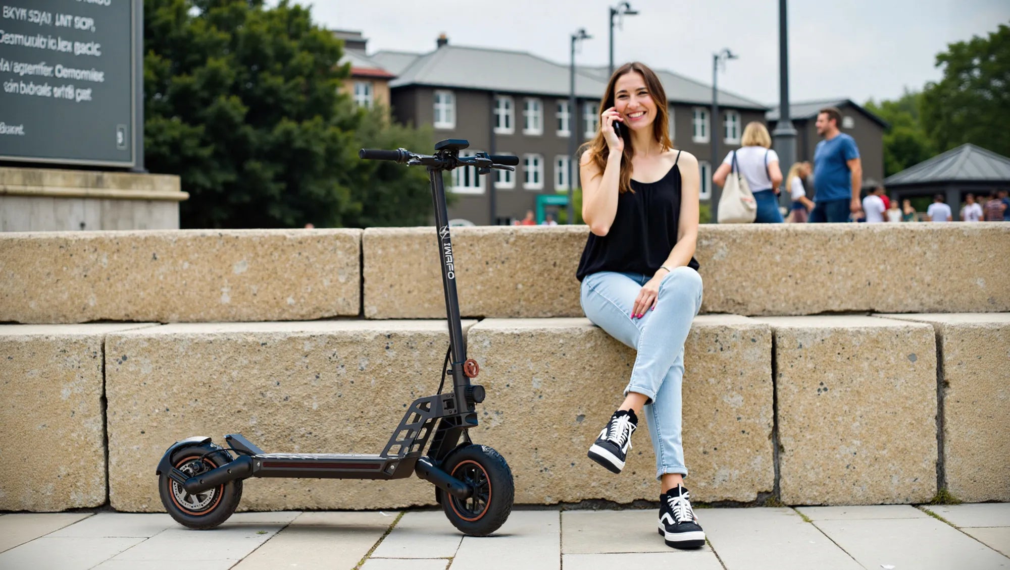 A_woman_is_on_the_phone_with_her_Electric-Scooter-IWAFO-IS1_parked_beside_her